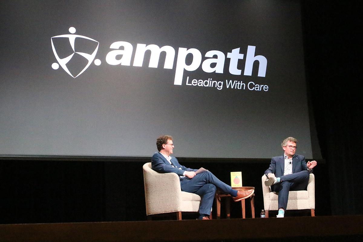 Dr. Adrian Gardner greets John Green